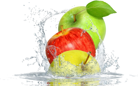 an apple is splashing into the water