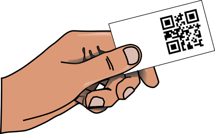 a hand holding a qr code