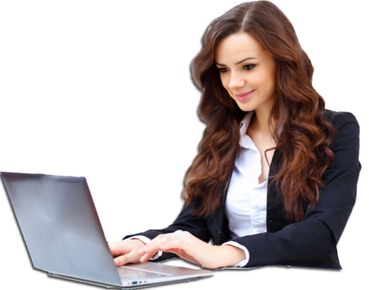 a woman sitting at a desk using a laptop