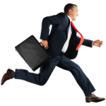 a man in a suit running with a briefcase