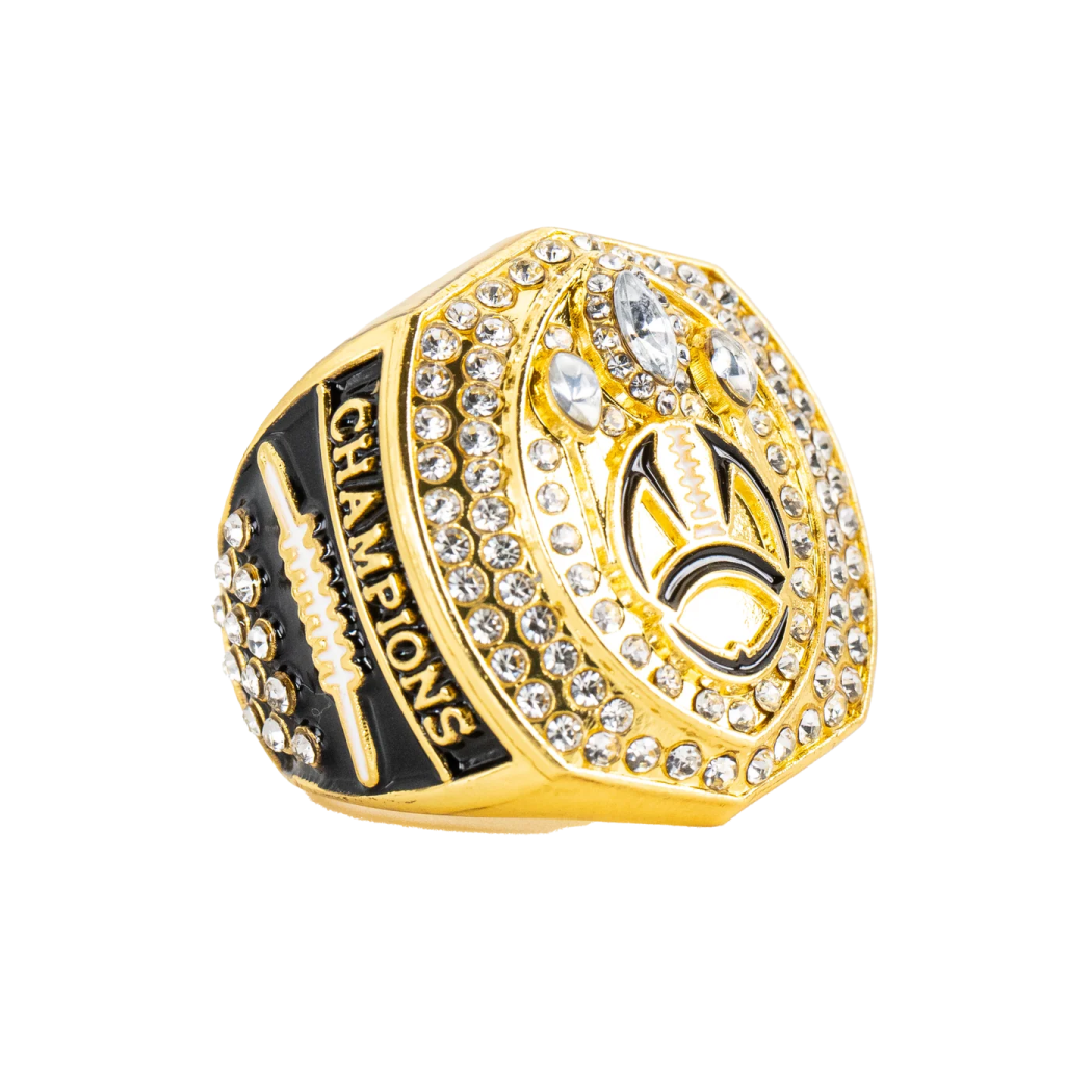 a gold ring with black and white stones
