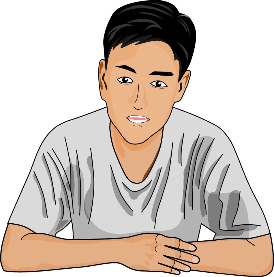 a man sitting at a table with his hand on his chin