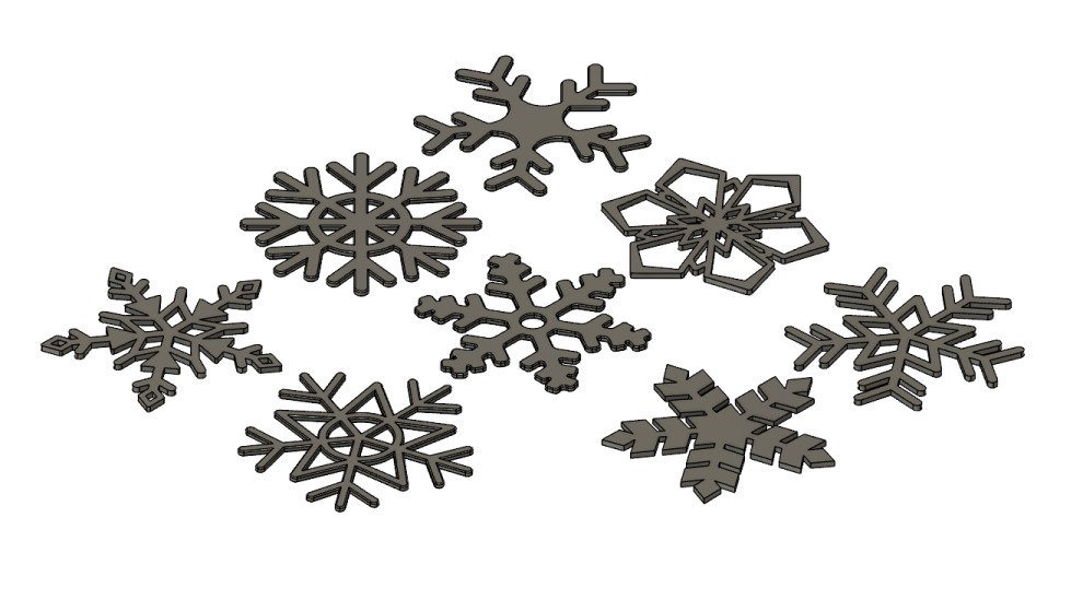 a bunch of metal snowflakes on a white background