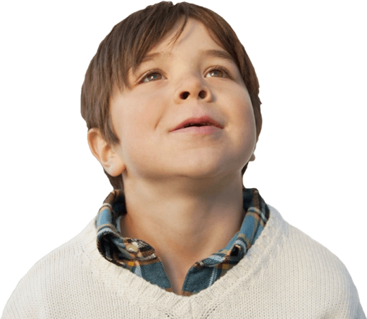 a young boy looking up at the sky