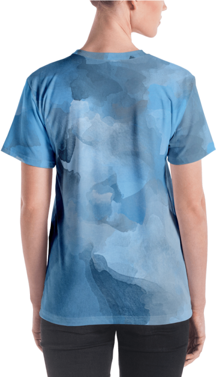 a woman wearing a blue camouflage t - shirt