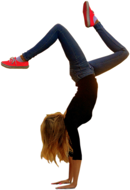 a woman doing a handstant in the air