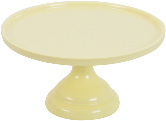 a yellow cake plate on a white background