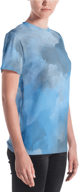 a woman wearing a blue t - shirt with clouds on it