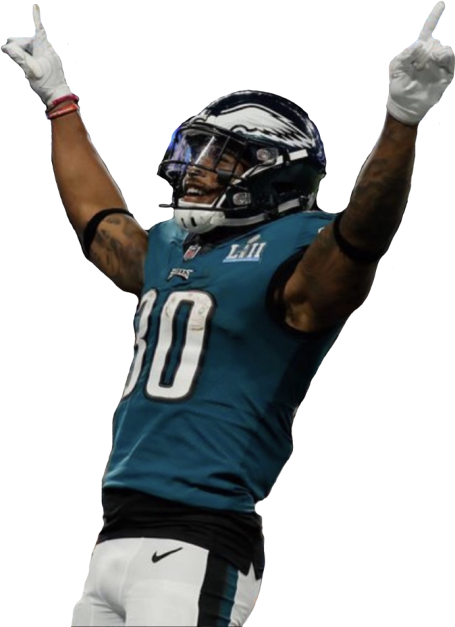 a football player with his arms up in the air