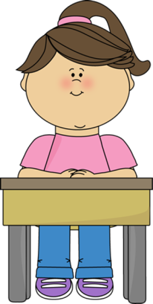 a little girl sitting at her desk