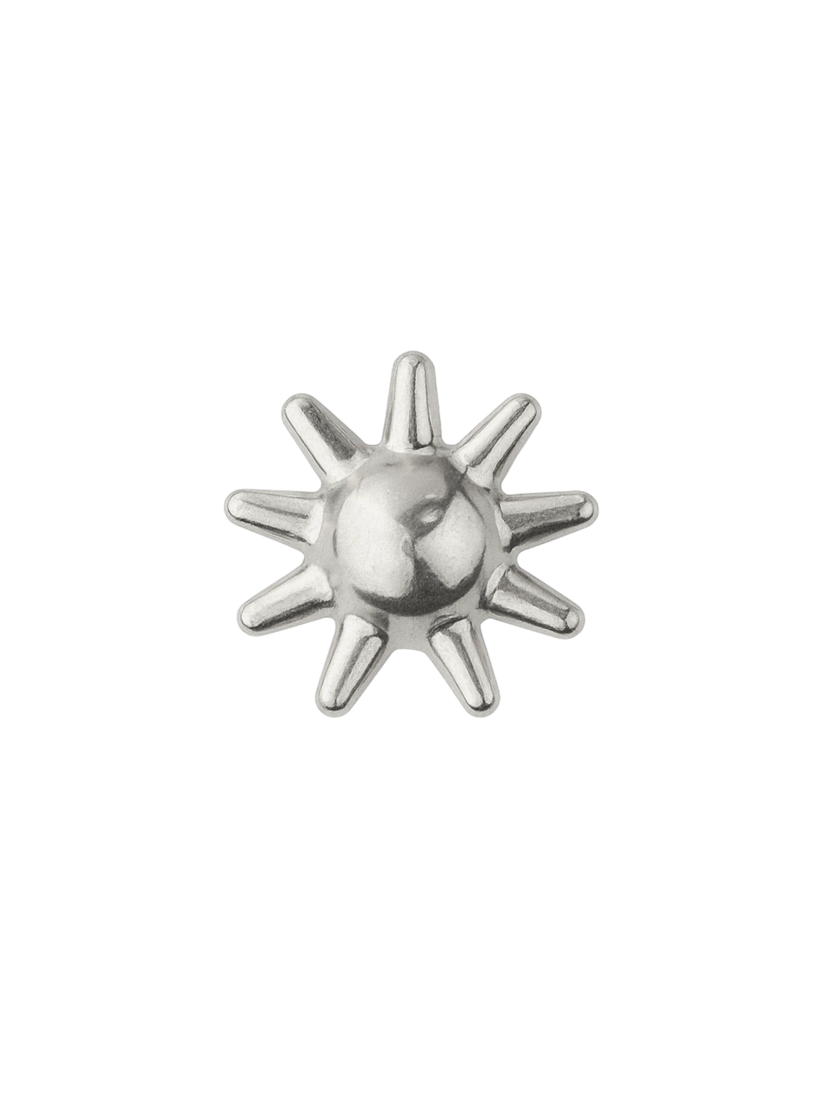 a silver sun charm on a white background
