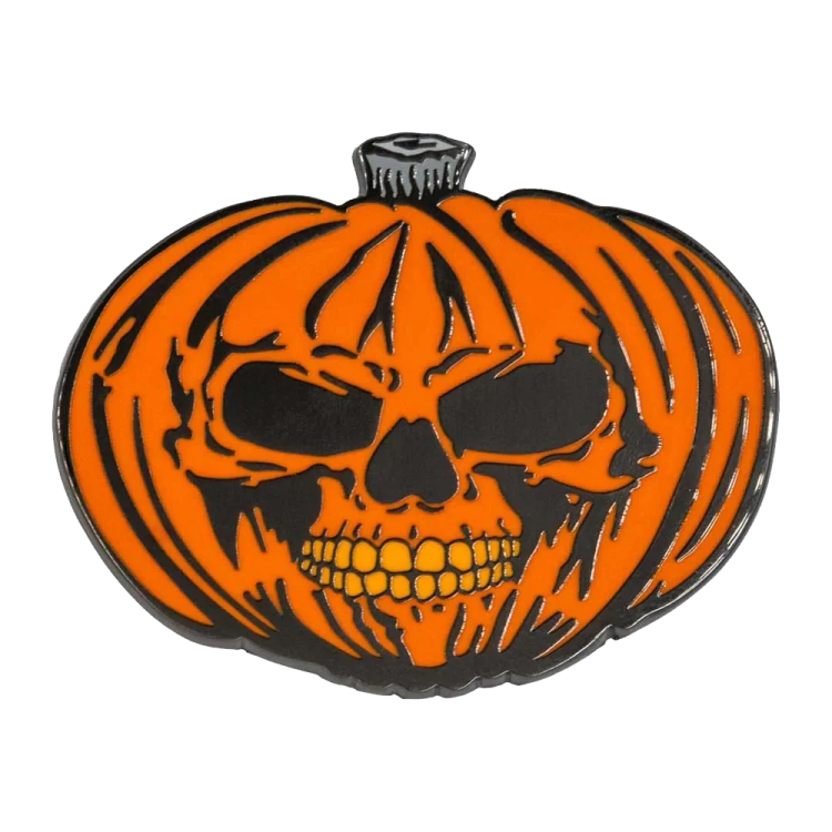 a black and orange pumpkin with a skull on it
