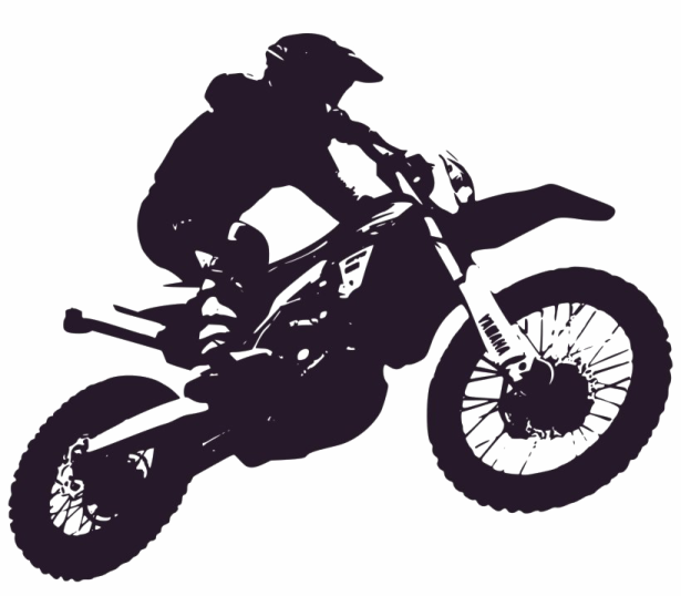 a silhouette of a person on a dirt bike