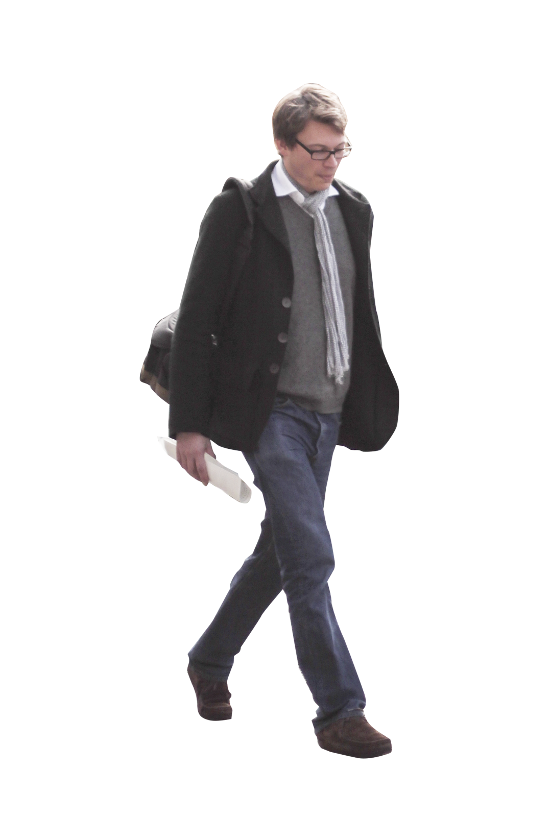 a man in a coat and tie walking down the street