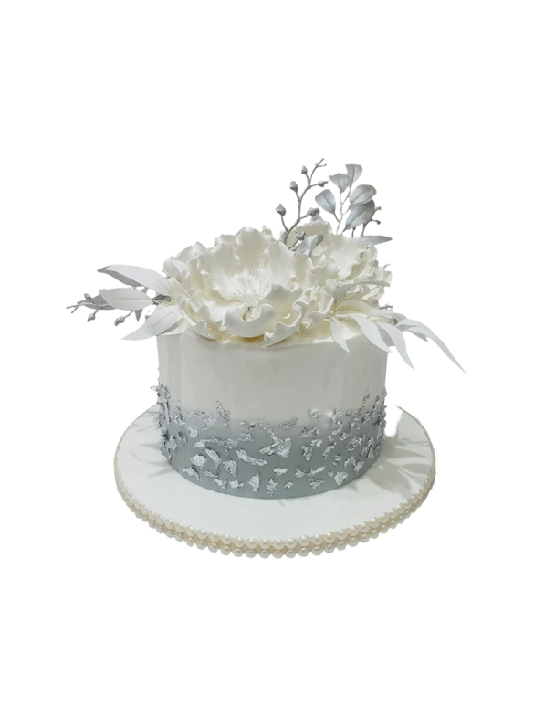 a white cake with flowers on top