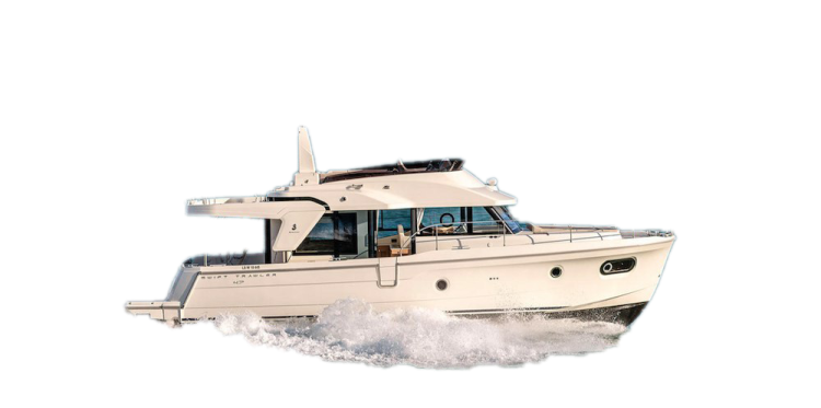 a white boat is driving through the water