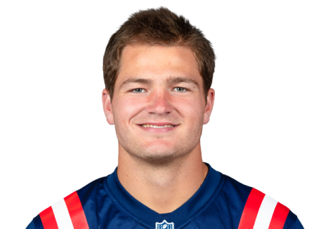 a young man in a football uniform
