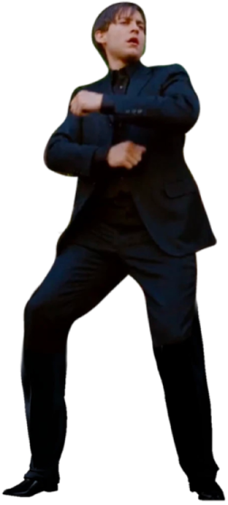 a man in a suit and tie with his arms crossed