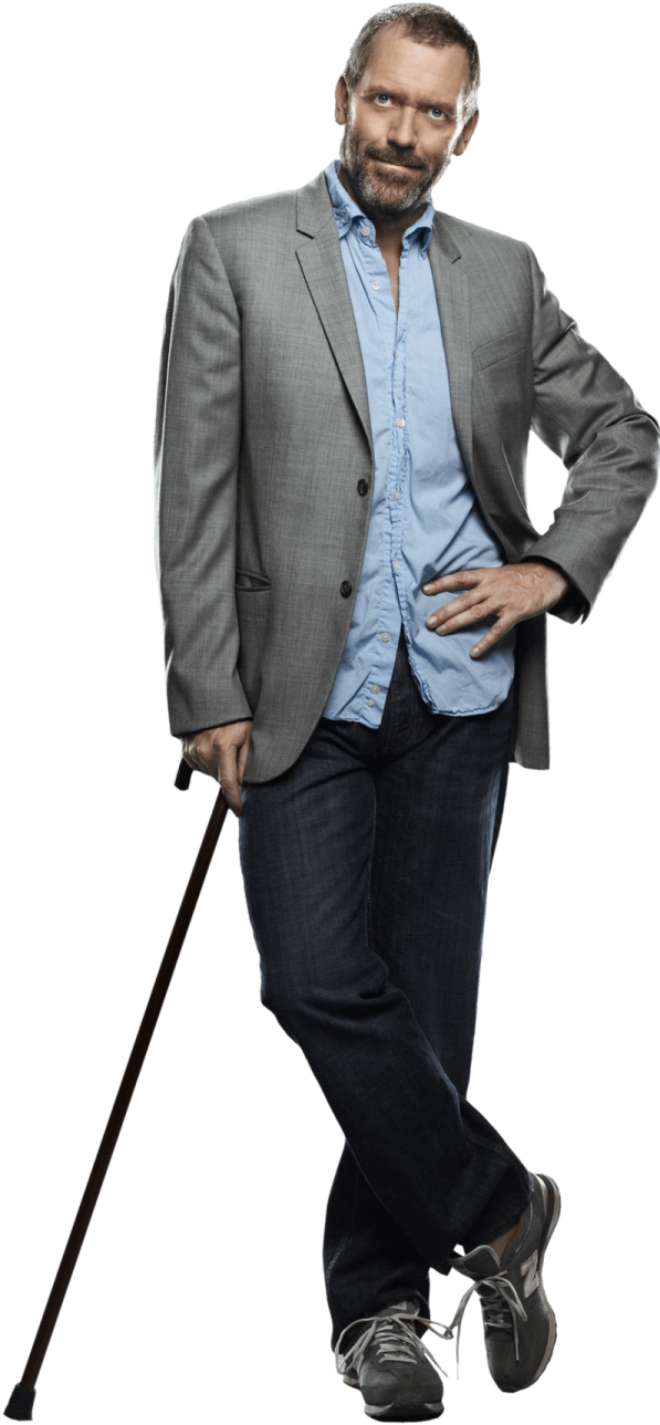 a man in a suit and tie holding a cane