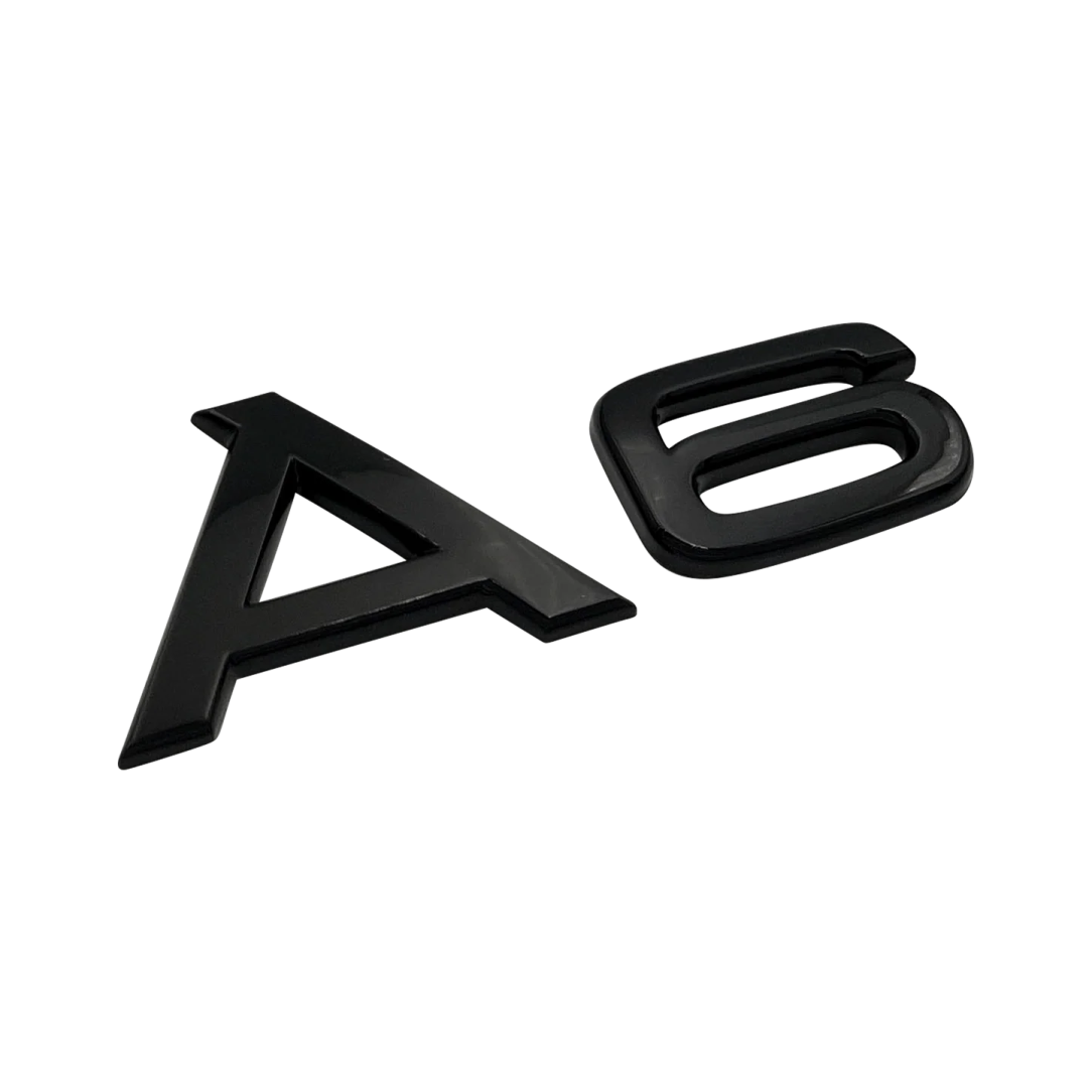 a pair of black plastic letters on a white background