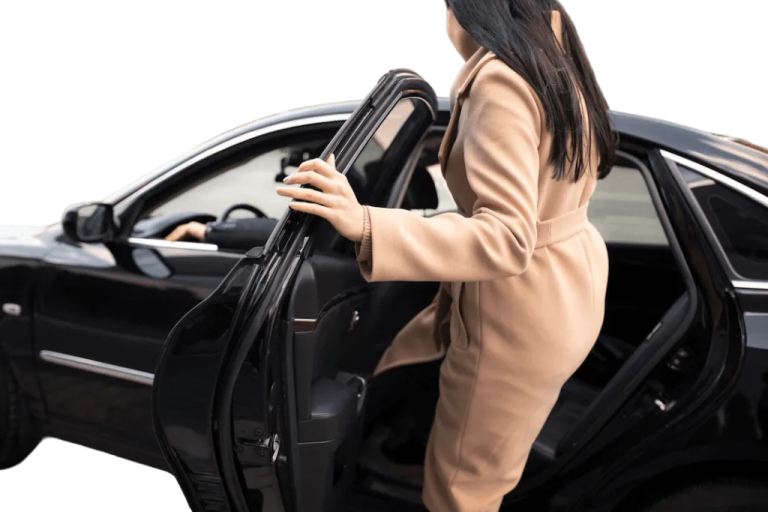 a woman is opening the door of her car