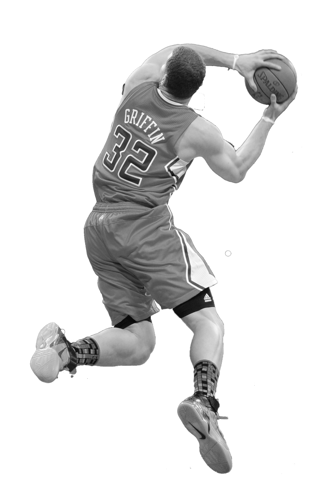 a black and white photo of a basketball player