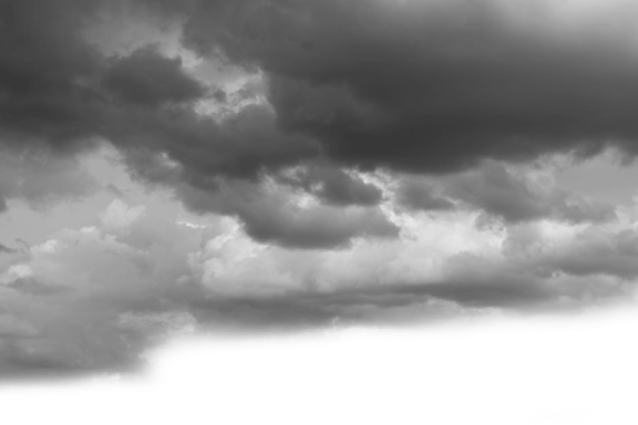 a black and white photo of clouds in the sky