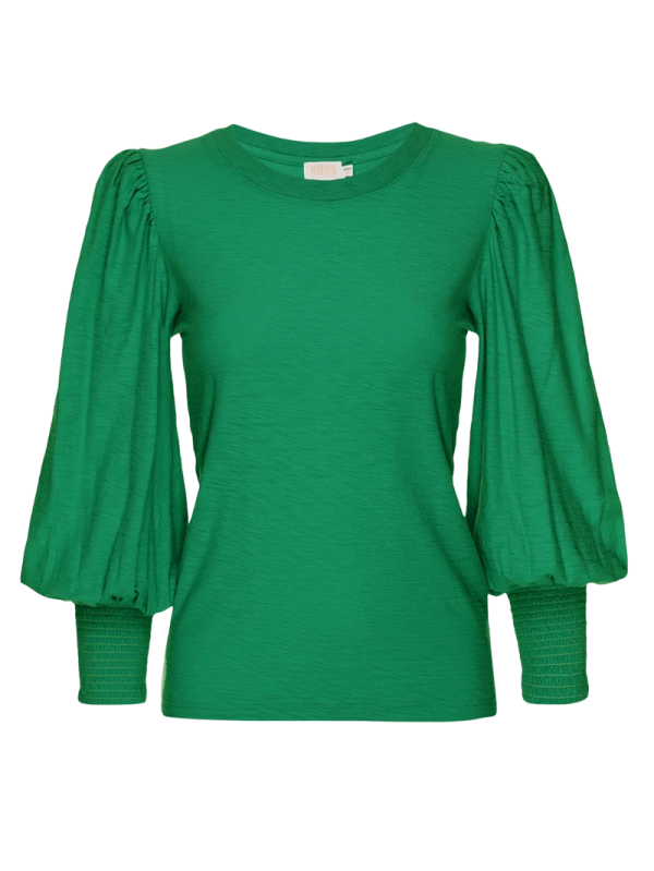 a green top with puff sleeves