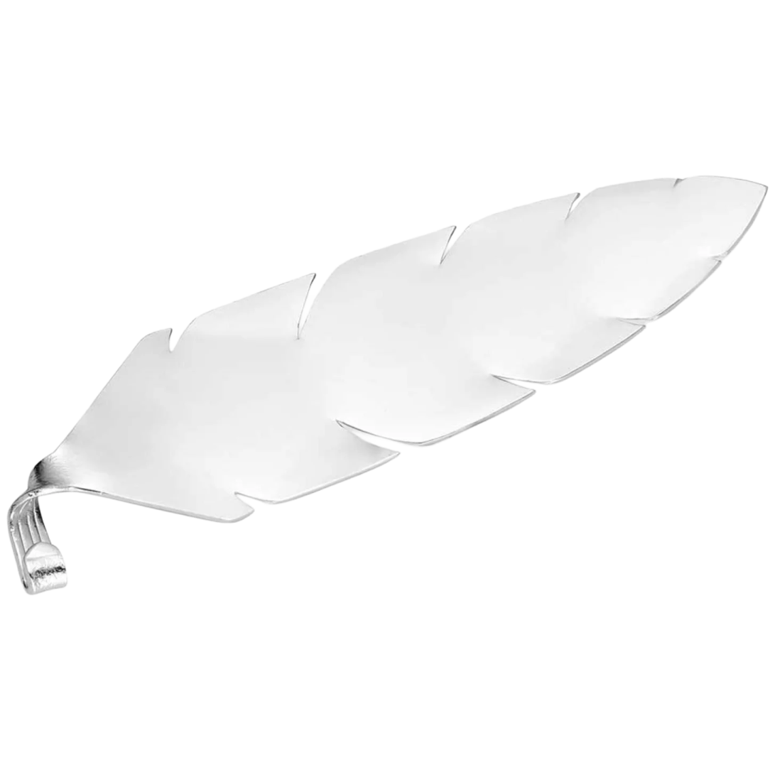 a silver plate with two leaves on it