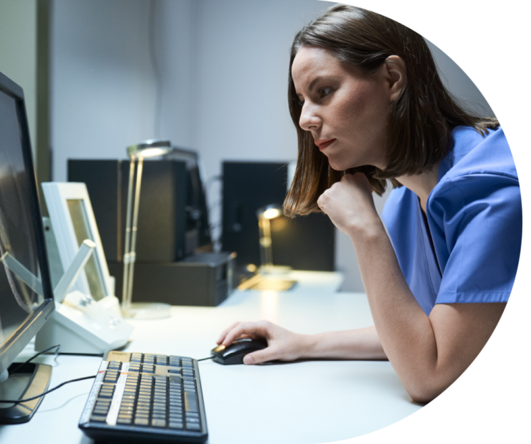 a woman sitting in front of a computer