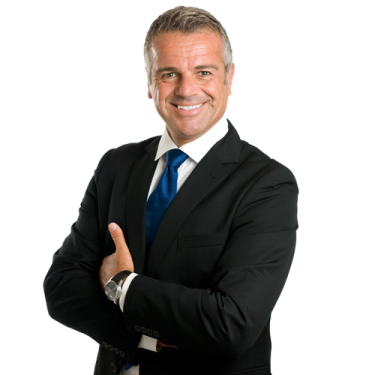 a man in a suit and tie with his arms crossed