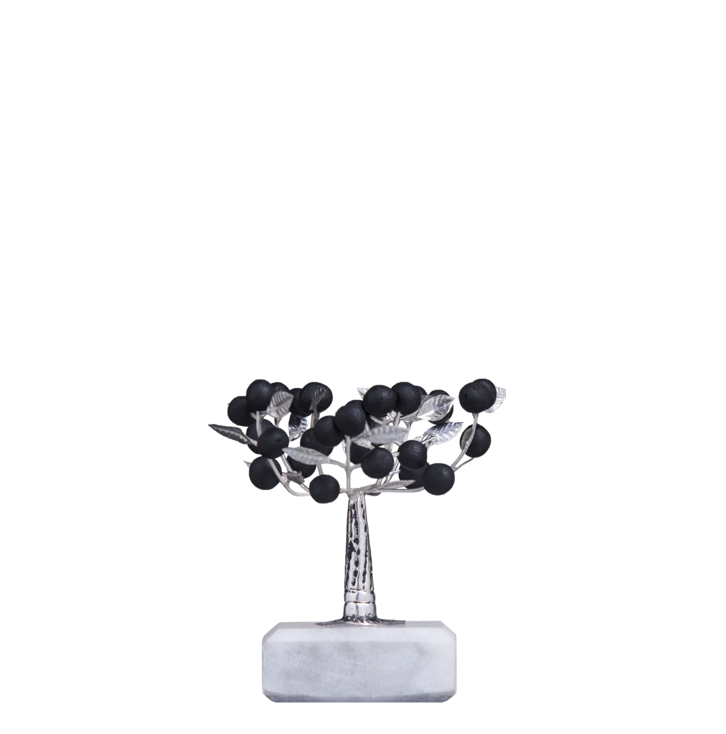 a silver vase with black flowers on it