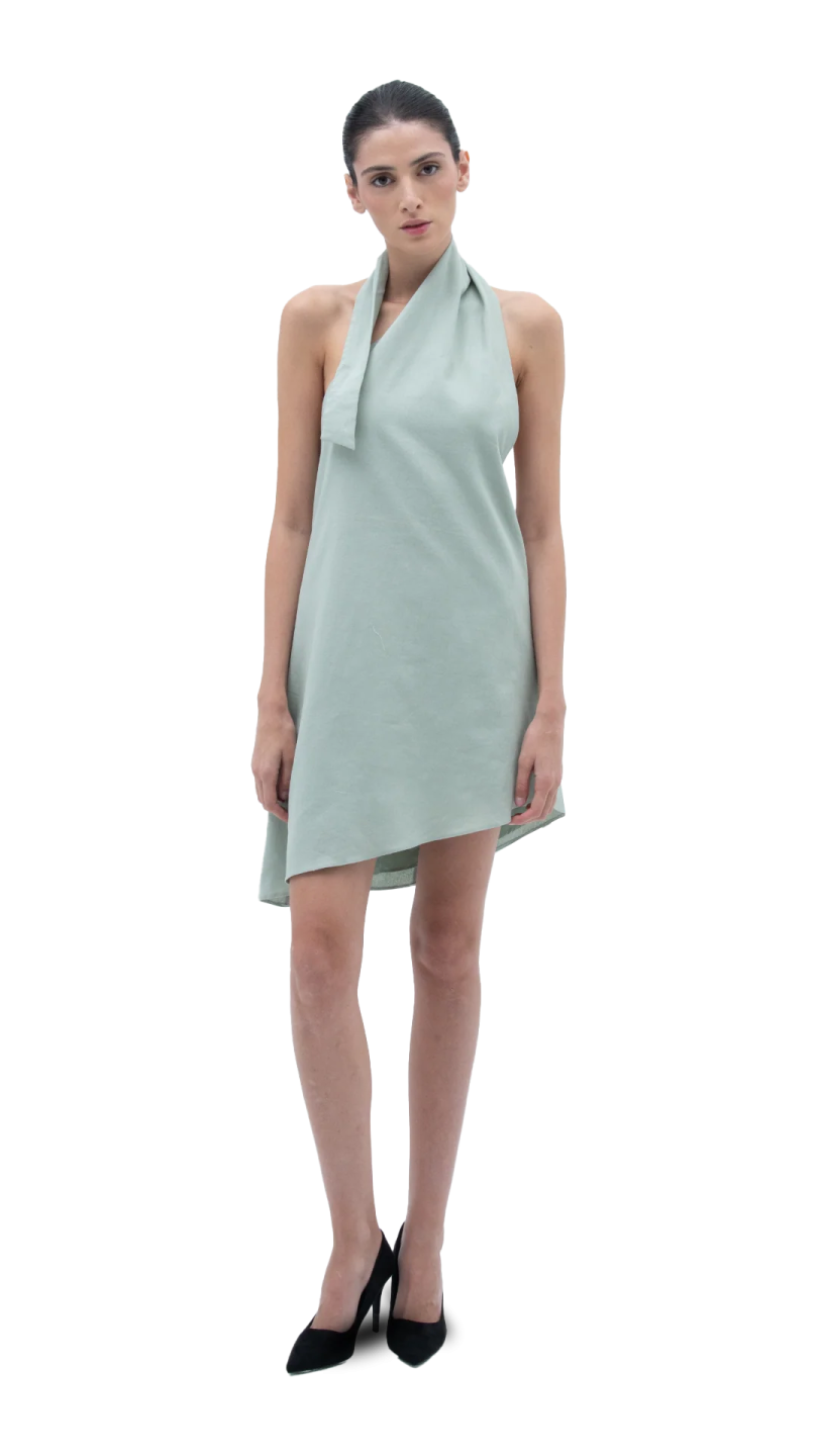 a model in a light green dress