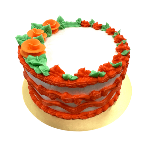 a cake with red frosting and green decorations