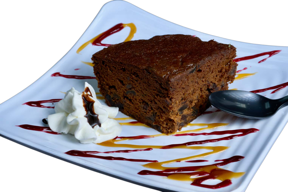 a piece of cake on a plate with a spoon
