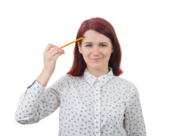 a woman holding a pencil in front of her face