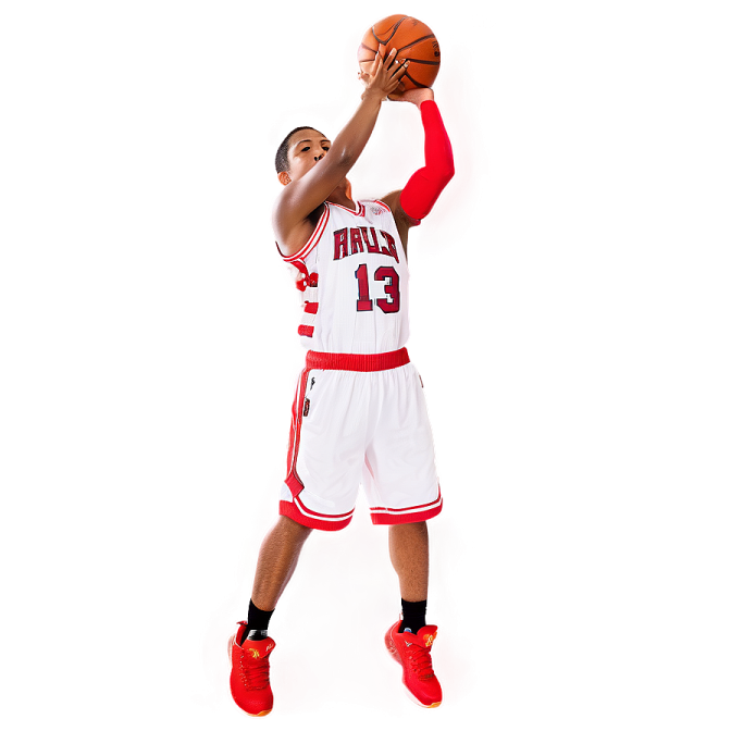 a man holding a basketball ball up in the air