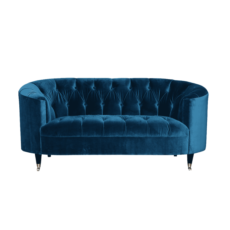 an image of a blue velvet sofa