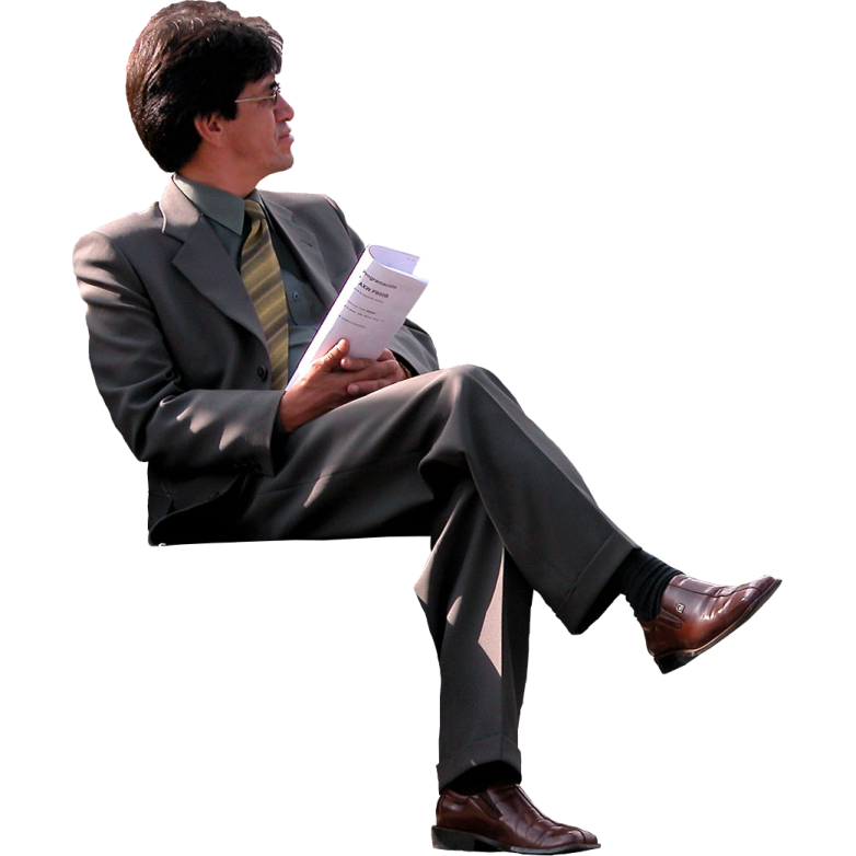 a man in a suit and tie reading a book