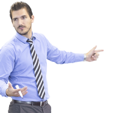 a man in a blue shirt and tie with his hands out