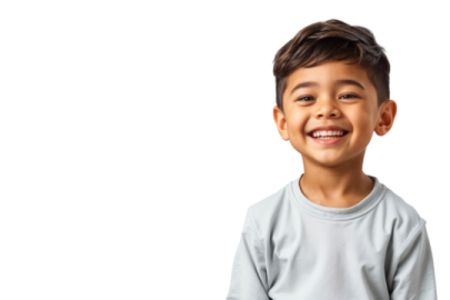 a young boy smiling with his hands in his pockets