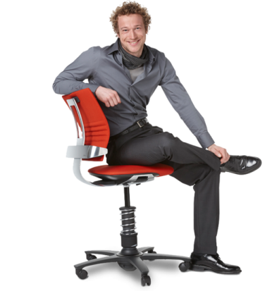 a man sitting on a red office chair