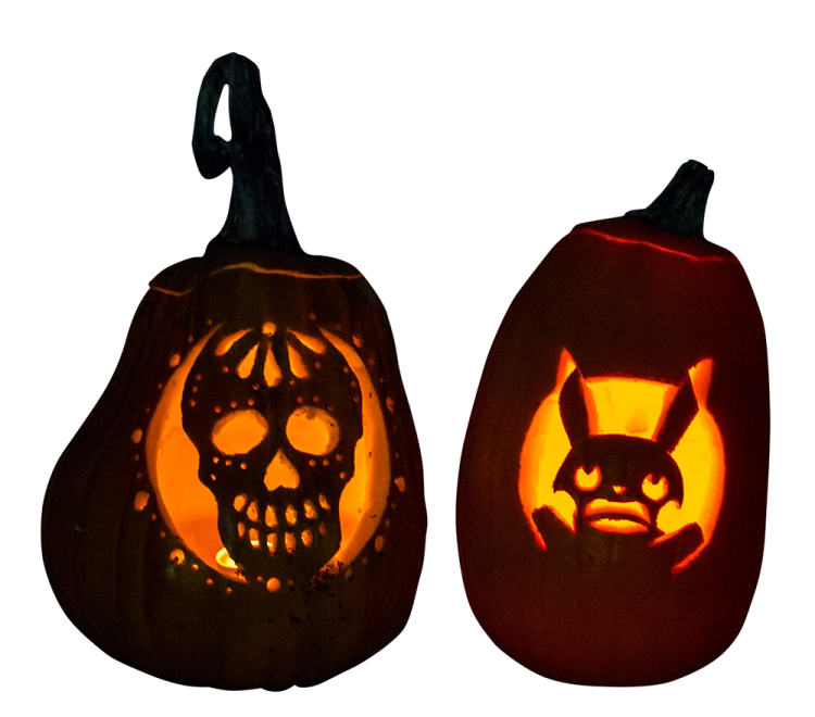 two pumpkins with faces carved into them