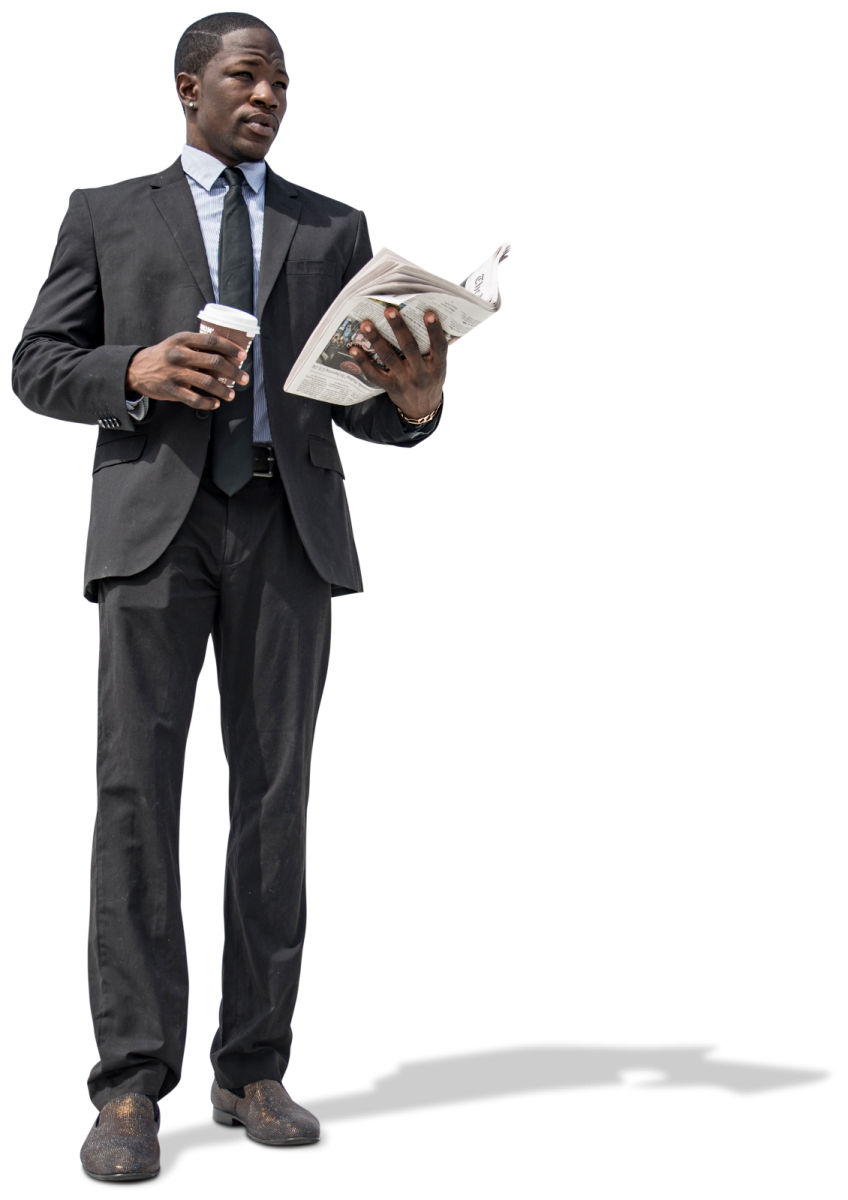 a man in a suit and tie reading a newspaper