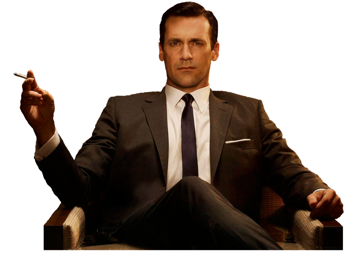 a man in a suit smoking a cigarette