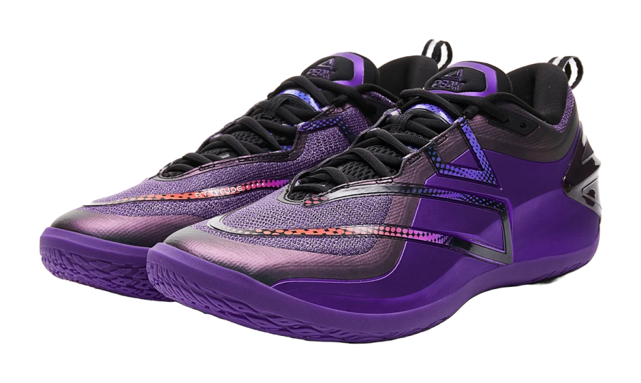 a pair of purple and black basketball shoes