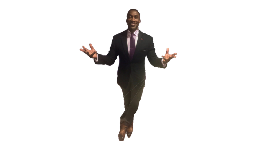 a man in a suit and tie is jumping