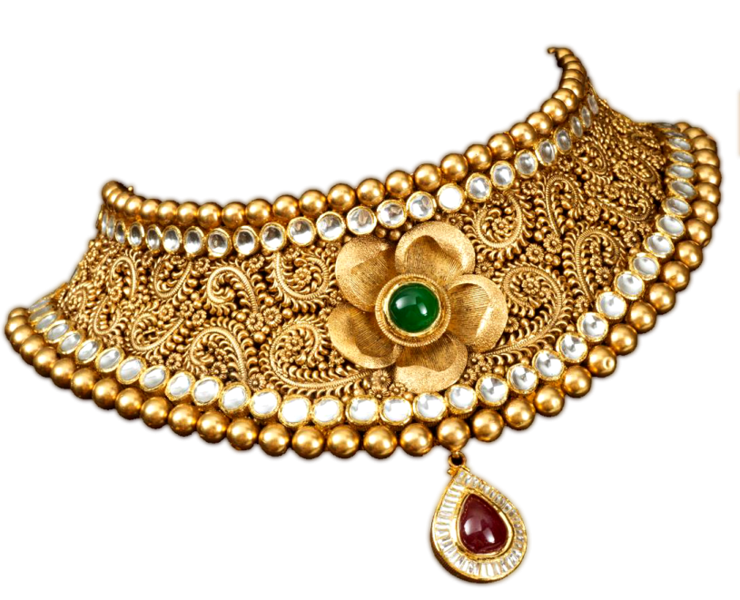 an antique gold choke with emerald and pearls