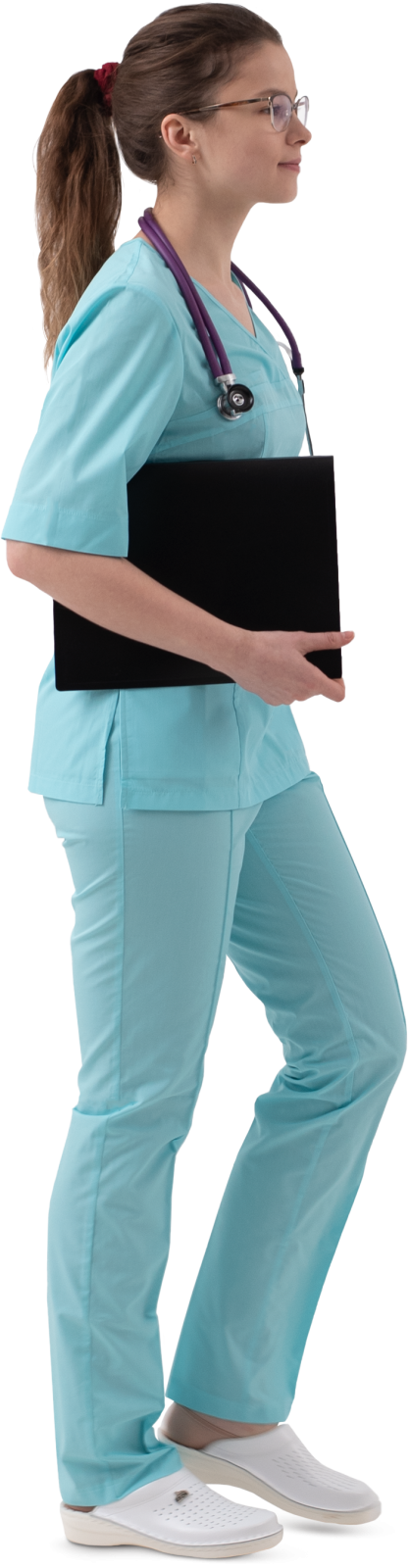 a woman wearing scrubs and holding a laptop