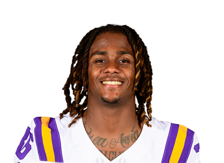 a man with dread hair wearing a football uniform